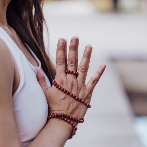close-up-view-of-asian-woman-doing-yoga-in-a-park-2024-11-03-00-22-00-utc-min